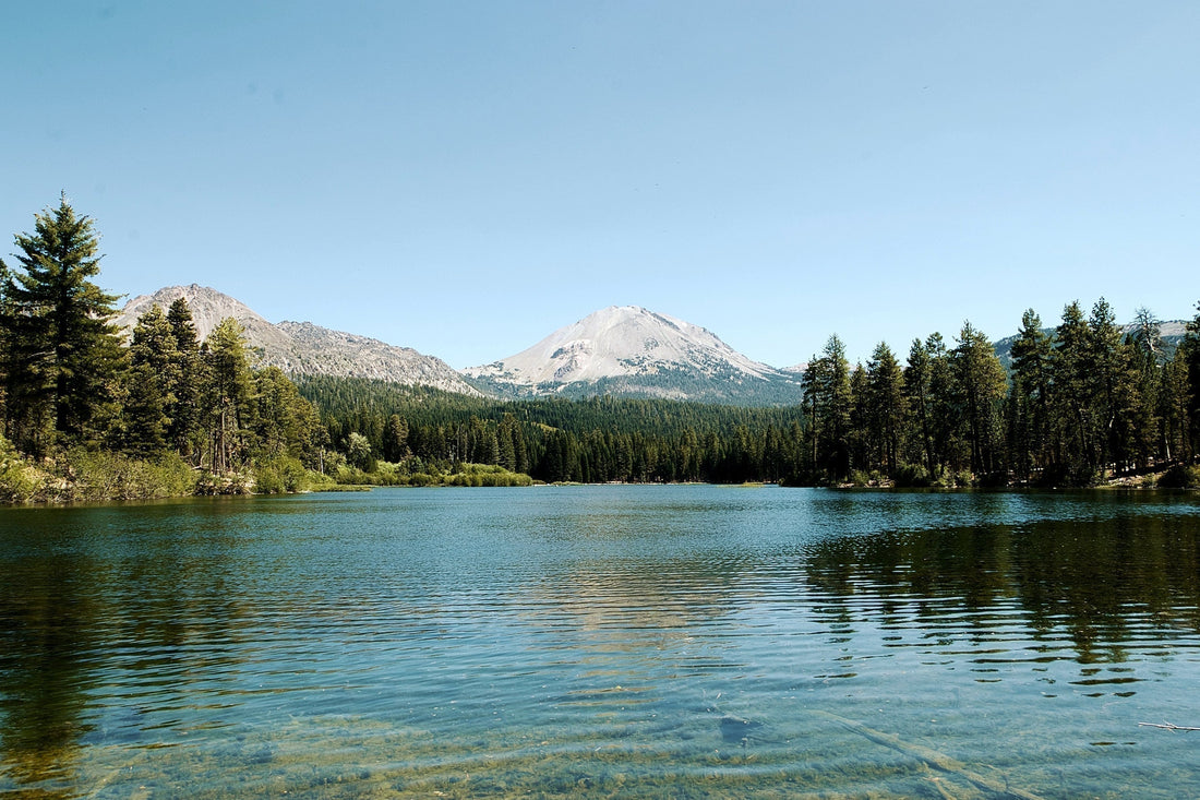 Beautiful Lake Surrounded By Mountains And Trees Calm Water