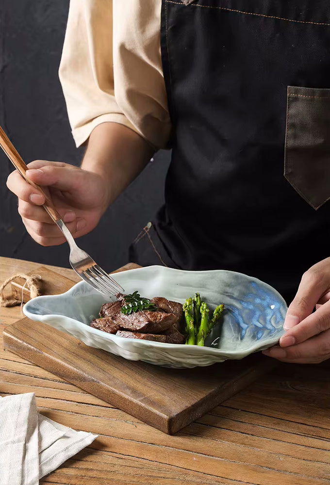 Eating Steak And Asparagus From Seashore Style Oyster Shape Ceramic Dish