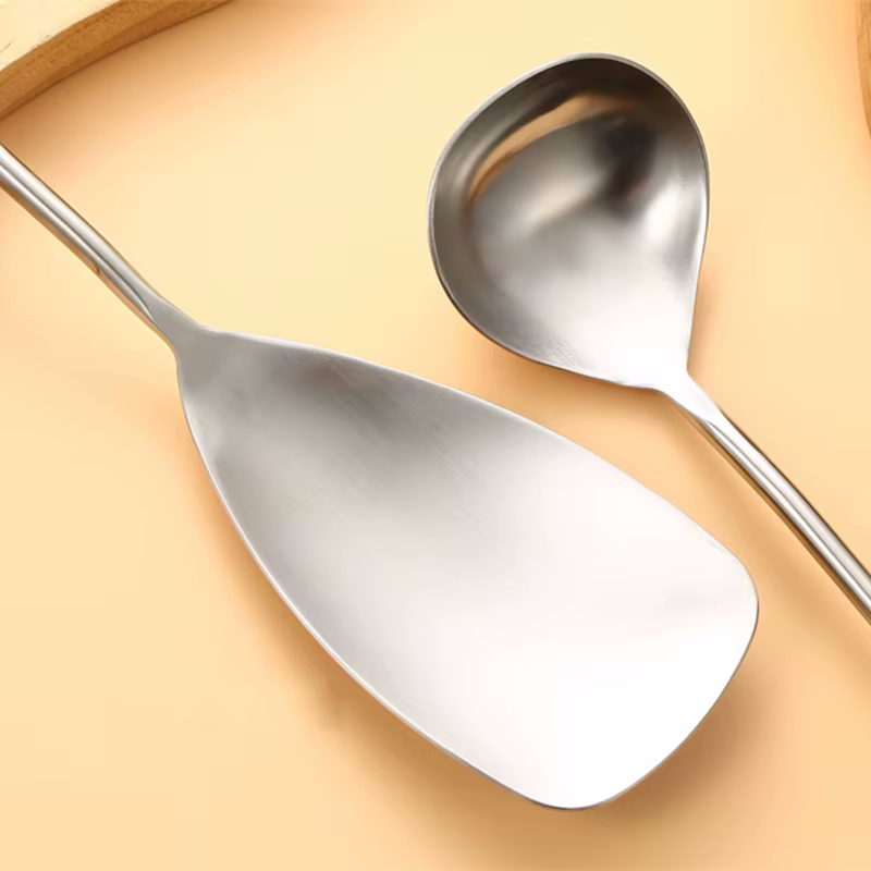 Stainless Steel Serving Spoon And Ladle Closeup Smooth Metal Cooking Utensils