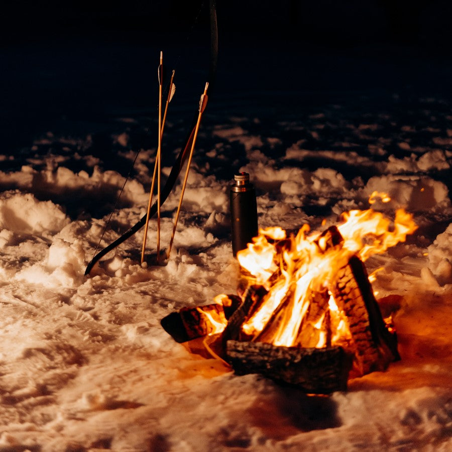 Warm Campfire On The Snow With Hunting Arrows And A Hot Thermos Of Fire Roasted Warrior's Yaupon Holly Tea From Terra Powders Clean Food Market
